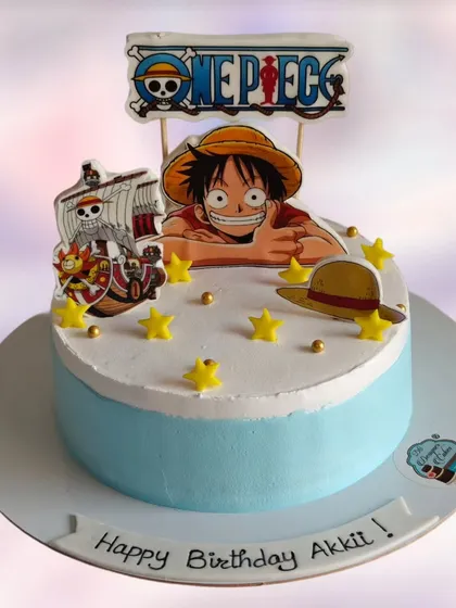 A One Piece anime-themed cake for a fan's birthday. The cake features Monkey D. Luffy and the iconic pirate ship, ready for an adventure on the high seas.