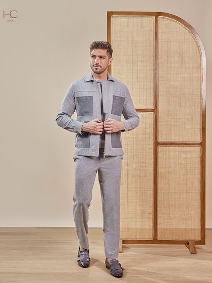 Arrive in a shacket and trouser set that blends ease with an urban edge. This grey monochrome look features statement pockets and tailored comfort, making it both functional and fashionable.