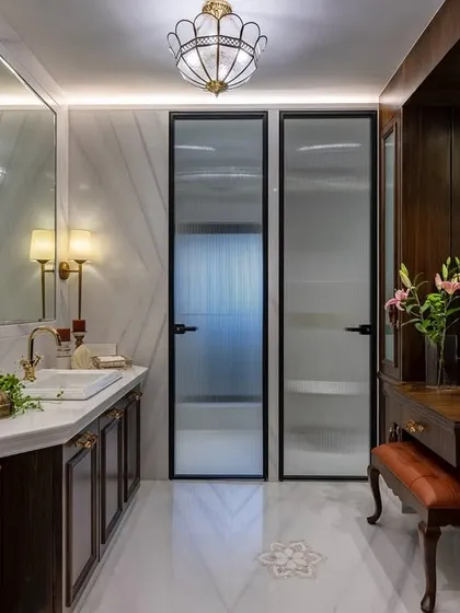 In this luxurious 2400 sq. ft. home in Thane, I designed the bathroom to be a harmonious retreat where functionality meets luxury. Classic wood paneling, ornate hardware, and elegant lighting transform daily routines into moments of joy.