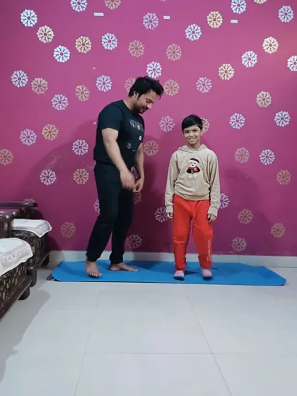 A proud coach moment after my young student successfully completed his yoga poses.
