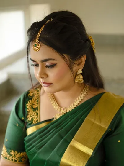A close up of the makeup for the green saree look, featuring soft, neutral tones.