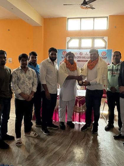 A group photo after a successful championship event. These gatherings are important for building camaraderie and sharing knowledge within the martial arts world.