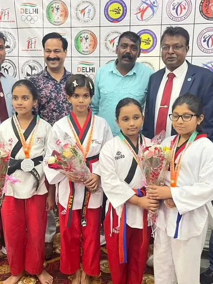 A group photo with some of my young champions and officials at the Delhi State Taekwondo Championship. It is an honor to guide these talented athletes.