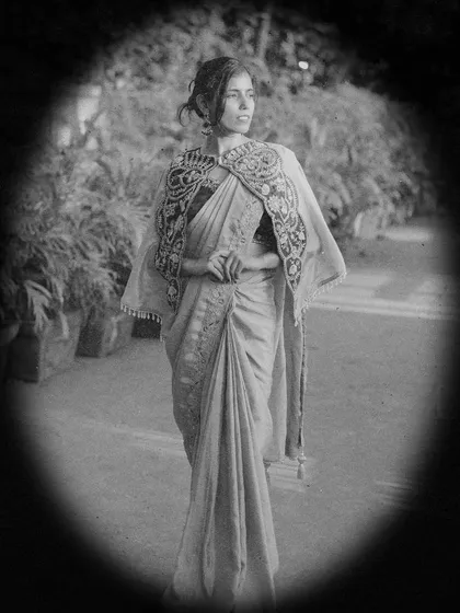A vintage-style black and white portrait. The edit and composition are inspired by 1950s photography, creating a timeless and royal feel for this ethnic look.