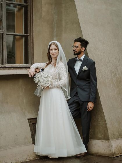 A classic portrait of the couple, with the groom looking lovingly at his bride. Her serene expression and his gentle gaze tell a story of deep connection.