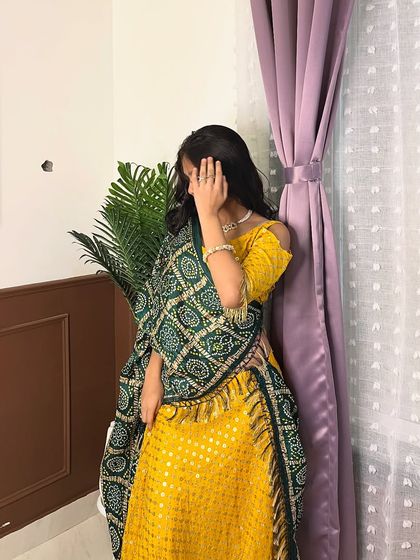 A candid shot showing the beautiful flow of the yellow Navratri lehenga. Perfect for twirling on the Garba floor.