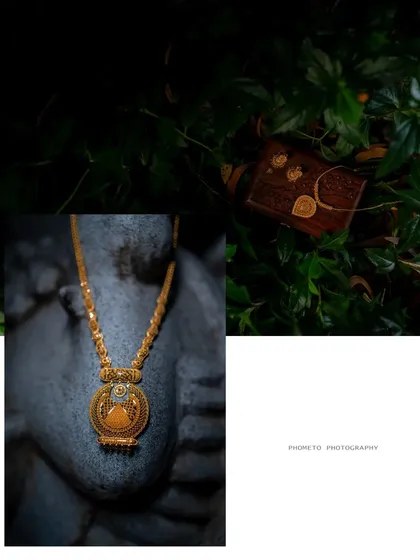 An artistic still-life of the bride's traditional gold necklace and other wedding details, captured with a creative eye.
