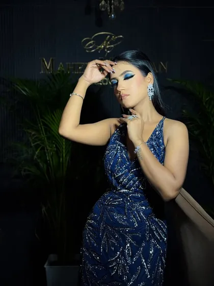 A different model showcasing another blue smokey eye look. This demonstrates the versatility of the color and technique.