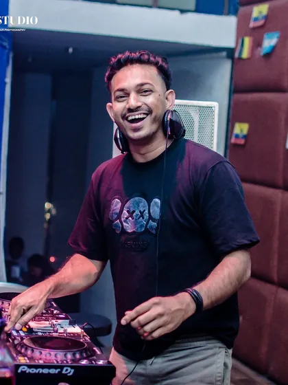 A happy moment behind the decks. You can see the genuine joy I get from performing and making people dance.
