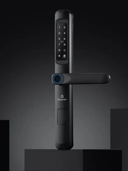 This composition for the Phynart smart lock uses dark blocks to create a pedestal, making the product look important and robust. The lighting is focused on highlighting the form and the glowing blue accents.
