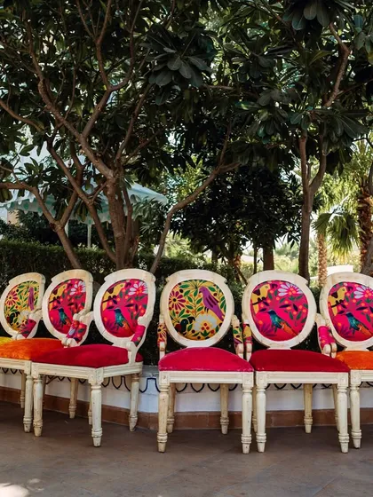Adding a pop of color to a royal Jaipur celebration. These custom chairs with vibrant, artistic upholstery were a standout detail at a Haldi function, perfectly matching the festive and contemporary theme.
