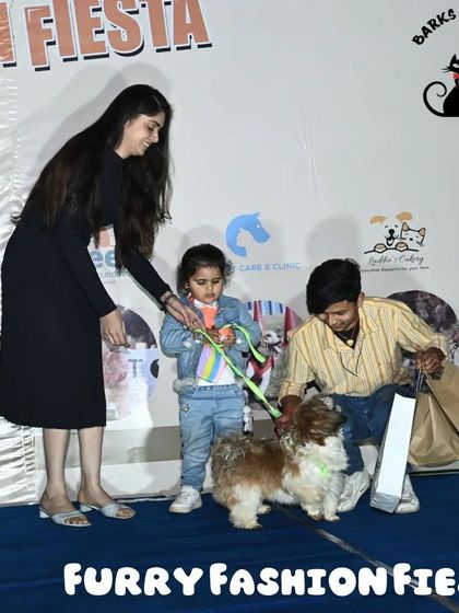 A young pet parent and her family celebrating their win on stage. My events are designed to be family-friendly, with a welcoming atmosphere for everyone.