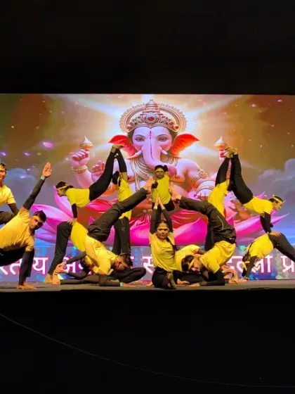 This synchronized acro yoga pose was part of a larger performance, demonstrating the precision and grace our students learn. Each member holds a strong, balanced position to create a stunning visual effect.
