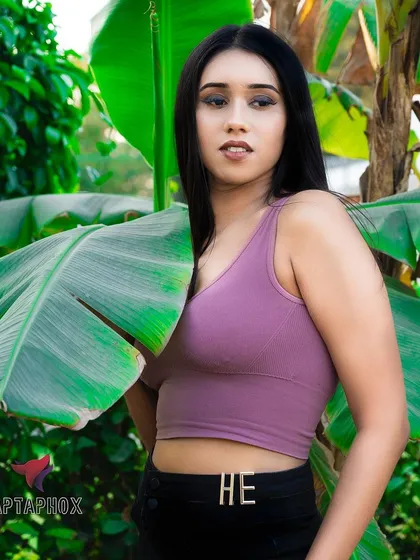 A vibrant outdoor portrait that uses natural light and a lush green background. This shot demonstrates my ability to work on location, creating fresh and lively images that feel both candid and professionally composed.