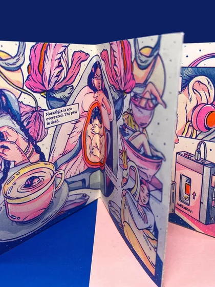 A detail shot of the inside of the Risograph zine, showing the beautiful layering of pink, blue, and yellow inks.