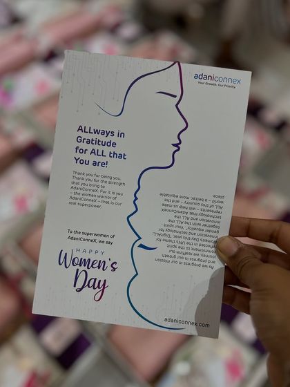 The 'Happy Women's Day' card from Adani Connex, which I included in each hamper. The message expresses gratitude for the strength and value the women bring to the organization.