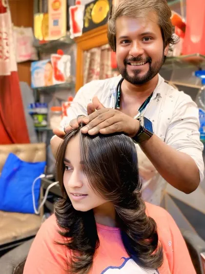 The final look of a beautifully layered haircut with a smooth, polished blowout. The layers are designed to fall perfectly, creating a sleek and sophisticated style.