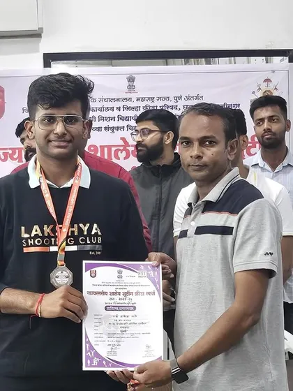 A proud moment for another one of my students, receiving his silver medal at the Interschool State Tournament. His smile reflects the satisfaction of hard-earned success.