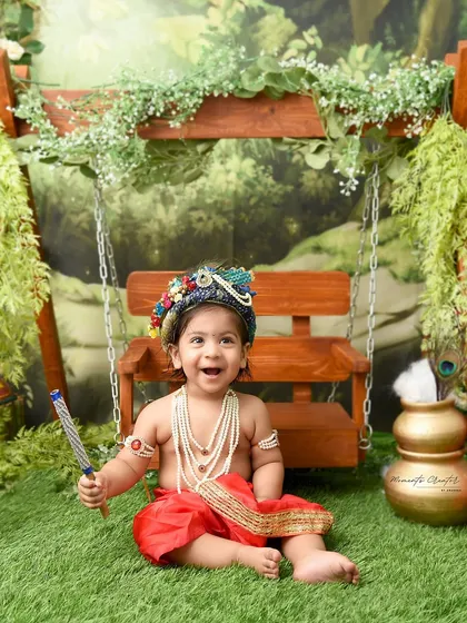 A joyful laugh from our little Kanha. This candid moment captures the pure happiness and playful nature that the Krishna theme celebrates.