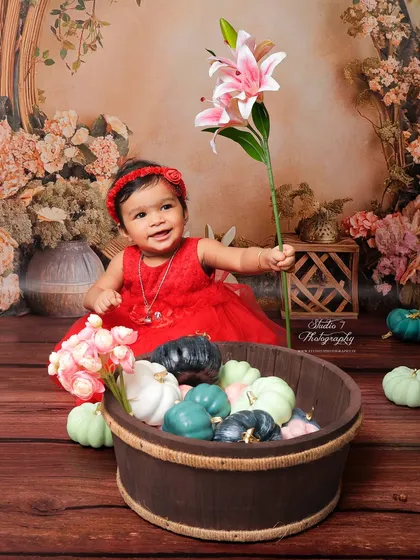 From the same floral studio session, this shot captures a different, delightful expression. I always take the time to get a variety of poses and moments during each photoshoot.