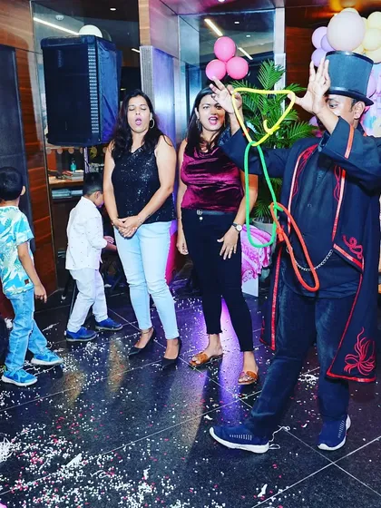 The linking rings forming an impossible shape. This is a classic piece of magic that captivates both adults and children at private parties.