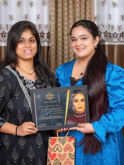 Another proud graduate from my academy. Each student receives a certificate of completion, validating their training in professional makeup and hairstyling.