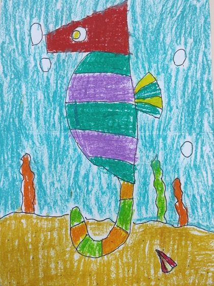 A bold, red-headed seahorse. We encourage students to be fearless with their color choices and create striking images.