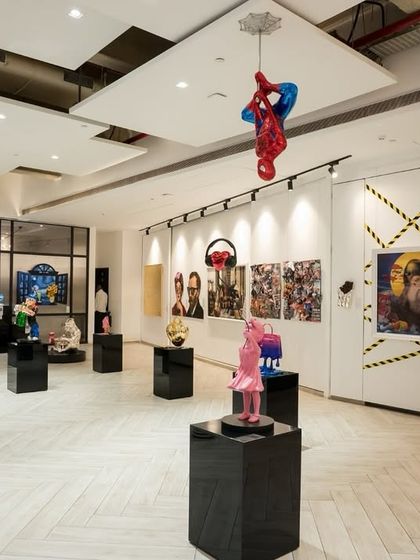 The thoughtful curation of our gallery floor ensures a balance between statement pieces and negative space. This view shows how we arrange artworks to create visual harmony and encourage unhurried appreciation from our visitors.