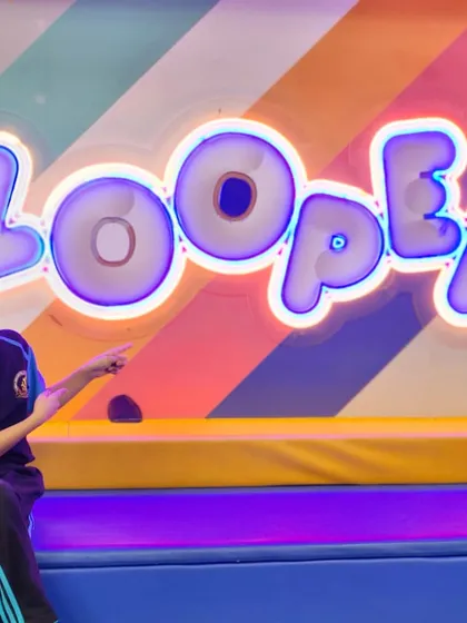 A student points to our iconic Zooper logo, ready for more fun.