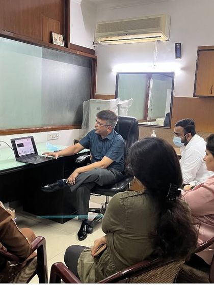 An intimate group of doctors engaged in a discussion about filler techniques at my clinic. These small sessions allow for deep dives into specific topics and personalized feedback.