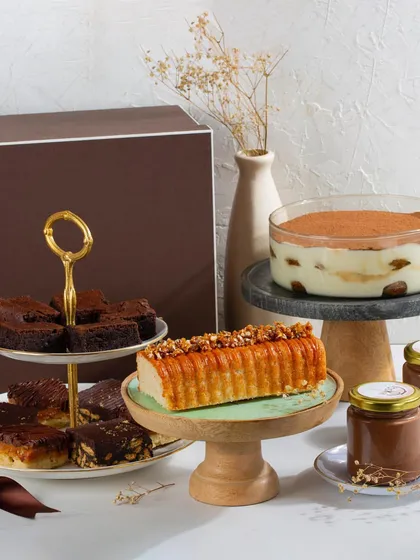 Getting into the festive spirit with a spread of my favorites, including Classic Tiramisu, a Vanilla Salted Caramel Loaf, and an assortment of rich chocolate bars.