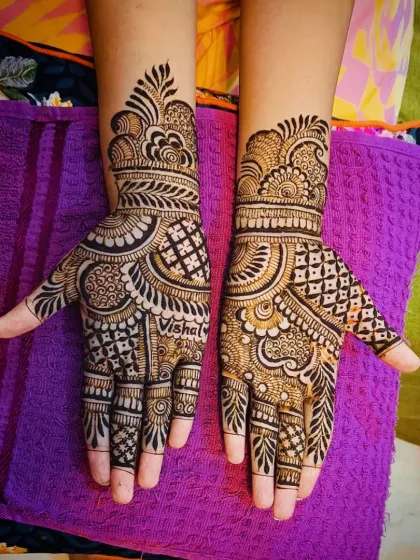 Another angle of the "Vishal" henna, showing the detailed work on the fingers and wrist.
