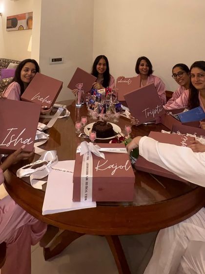 A beautiful moment from a bridal shower, with the whole crew holding up their custom-named proposal boxes. It’s a perfect photo opportunity and a memory they'll cherish.