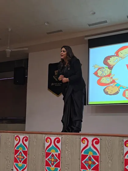 On stage at Mount Olympus School, presenting on the POCSO Act. The presentation behind me is designed to be visual and easy to understand, breaking down complex legal concepts for a young audience.