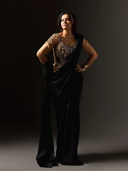 This look for Kajol in the film 'Maa' was inspired by the fierce energy of Goddess Kali. We collaborated with designer Torani to create a custom black saree with a fluid, untamed drape, paired with a gold corset blouse that acts as modern armor. It’s a powerful statement on divine feminine strength, designed to be both beautiful and intimidating.