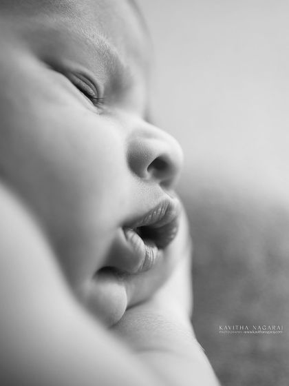 A black and white macro shot of a newborn's lips. My goal is to preserve the magic of these tiny details that you'll want to hold onto when they're no longer this little.