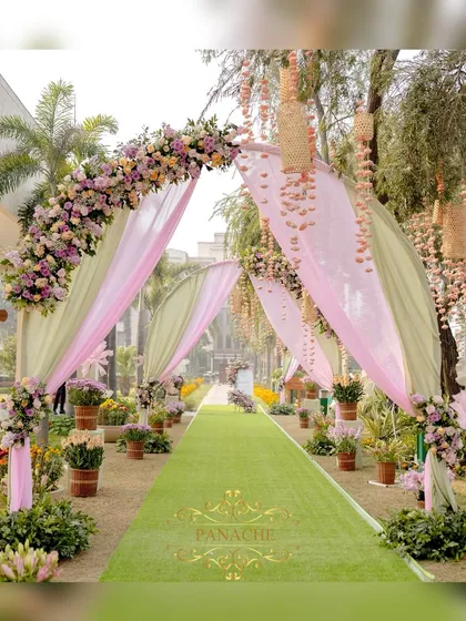We craft enchanting pathways that lead your guests into a different world. This dreamy entrance for a pastel-themed Mehndi features soft drapes, floral arches, and delicate hangings, setting a whimsical tone from the very first step.