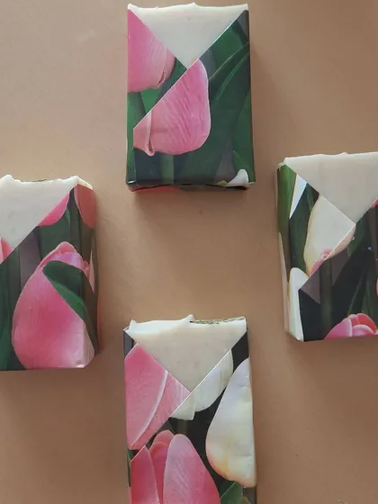Soaps dressed in their floral paper tuxedos, ready to be shipped. This packaging protects the soap while being completely sustainable and lovely to look at.