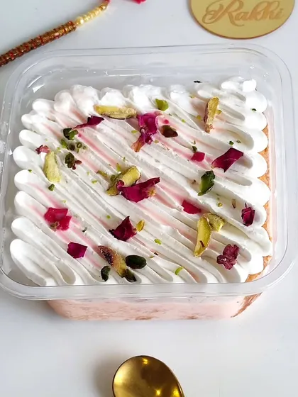 Inspired by the flavors of royal falooda, my Rose Tres Leches is a heavenly treat. The cake is infused with rose flavor and topped with delicate rose petals and pistachios for a fragrant and refreshing dessert.
