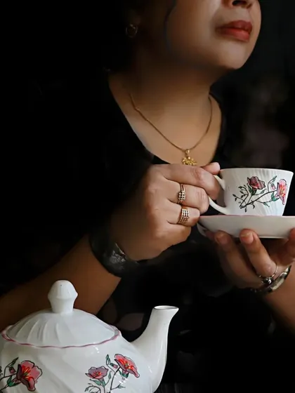 A moody self-portrait capturing the steam rising from a teacup. I used dark, dramatic lighting to create a sense of peace and introspection in this creative shot.