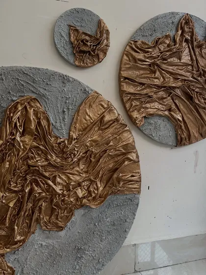The full set of three circular artworks for the Dubai residence. The different sizes create a dynamic arrangement on the wall, like planets or celestial bodies.