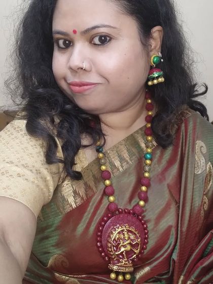 A selfie of me wearing my Nataraja (dancing Shiva) necklace. This piece is very special to me, combining rudraksha-style beads with a detailed pendant of the cosmic dancer.
