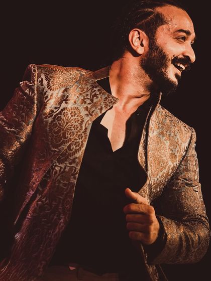 A candid, smiling moment captured on stage during a performance.