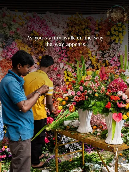 A behind-the-scenes look at our floral team meticulously creating a massive flower wall. This highlights the craftsmanship and effort that goes into our large-scale floral installations.