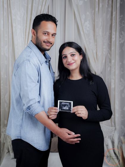 The first family photo. Holding up the ultrasound picture is a beautiful way to include your baby in the maternity shoot.