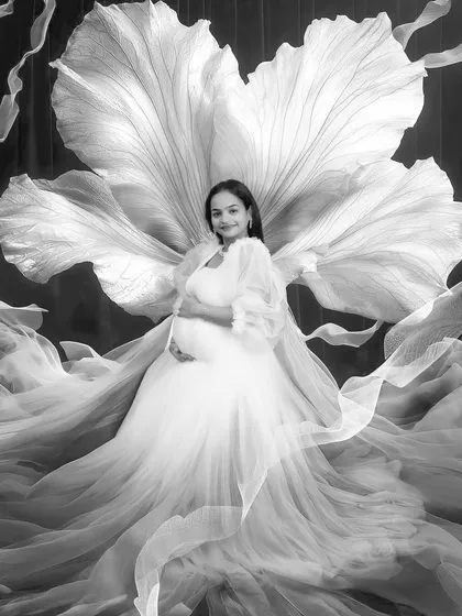 I also love creating timeless black and white portraits. This image focuses on the light, texture, and the serene expression of the mother to be, creating a classic piece of art.
