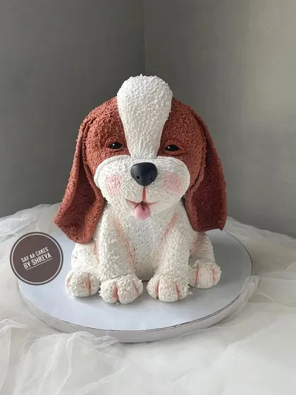 This cake was a special project to create a lifelike, sculpted puppy, and it's one of my favorites. I used detailed piping techniques to create the realistic fur texture, making this 3D dog cake a heartwarming and completely edible tribute for a pet lover.