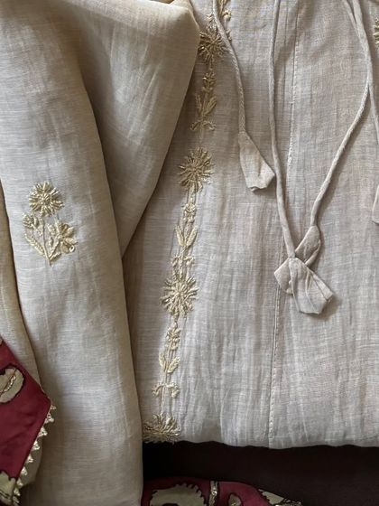 A macro shot of the fine Chikankari embroidery on the lower part of the Anarkali, demonstrating the consistent quality of craftsmanship.