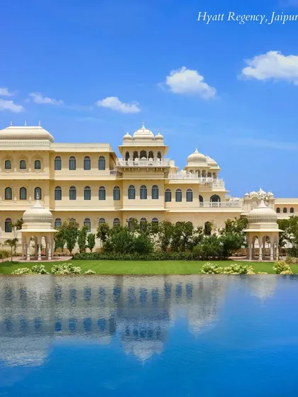 The stunning pool at Hyatt Regency, Jaipur, reflecting the clear blue sky. A beautiful setting for a vibrant poolside Haldi or Mehendi ceremony.