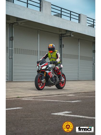 An Aprilia Tuono V4 rolling through the paddock. It's awesome to see naked bikes mixing it up with the superbikes.